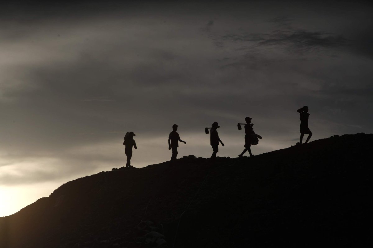 Soldiers walking through field