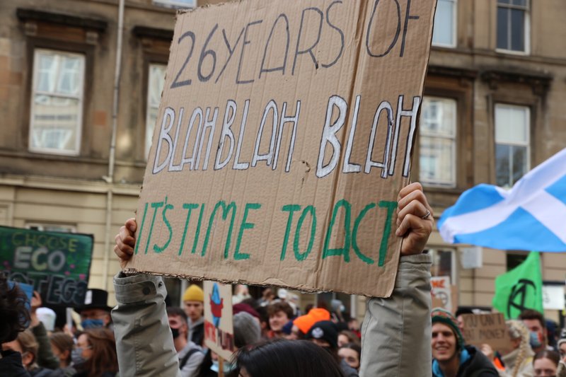 cardboard placard says
