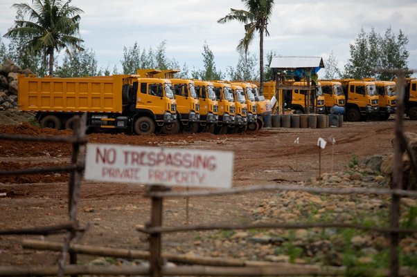 Dump trucks are seen inside a mining site in Sibuyan Island, Romblon province, central Philippines