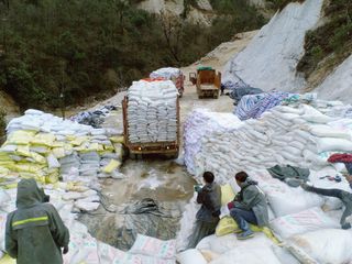 A truck delivers ammonium sulphate to a rare earth mine